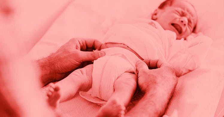 A baby crying while being changed