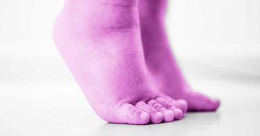 image of children's feet as they stand on their toes