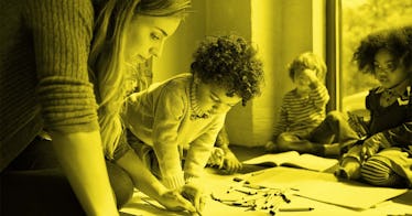 A mom drawing with crayons with her kids