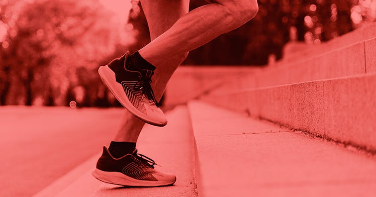 A pair of feet run up stairs with sneakers on them