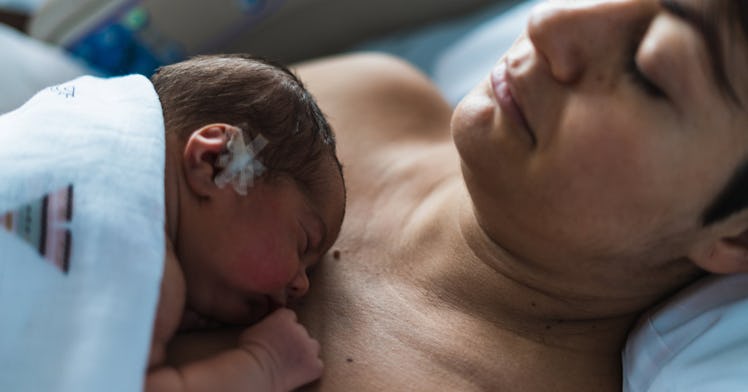 An infant and a parent do skin to skin bonding