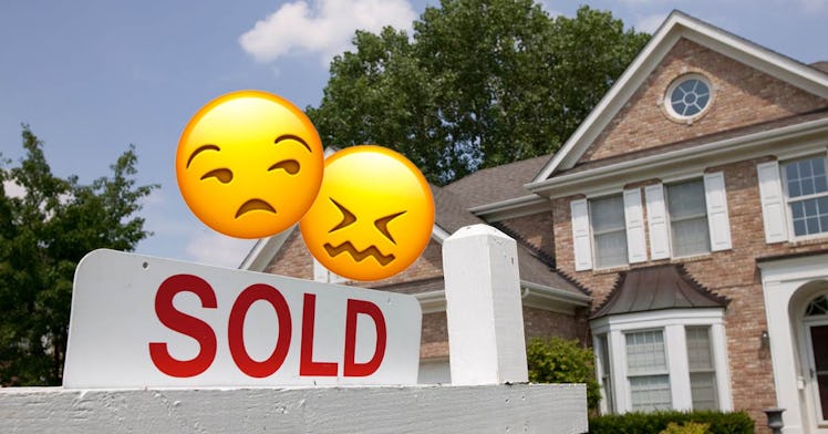 A house with a sold sign in front of it