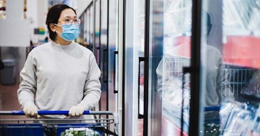 A shopper wears a mask at the store