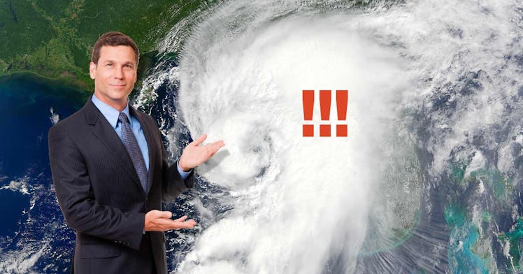 A meteorologist stands in front of a climate event on a map