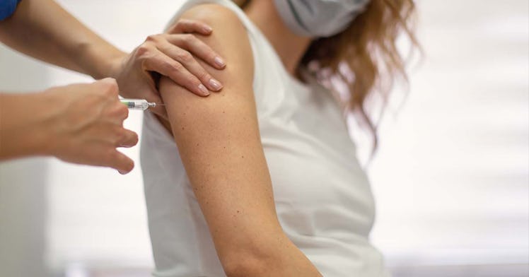 A pregnant woman gets a COVID vaccine