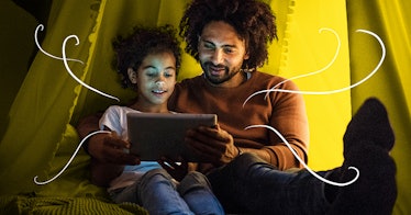 Father and daughter reading digital book on a tablet with yellow background