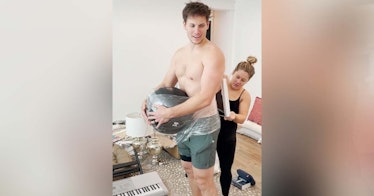 Shawn Johnson's husband Andrew East gets a weighted ball attached to him