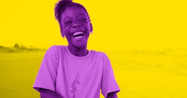 a little girl laughs heartily at a summer joke