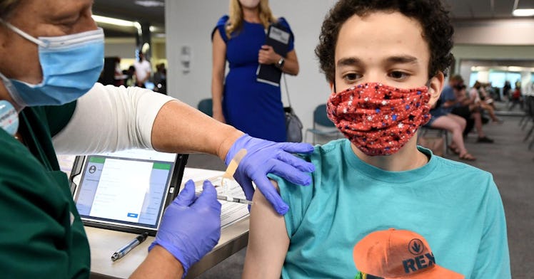 A teen receives a vaccine