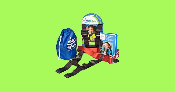 The Cares Kids Fly Safe Airplane Safety Harness against a green background