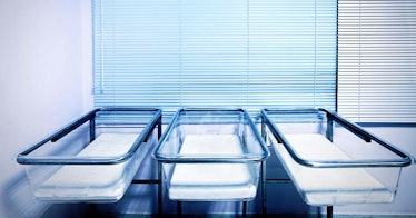 Three empty bassinets at a hospital