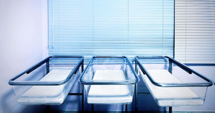 Three empty bassinets at a hospital
