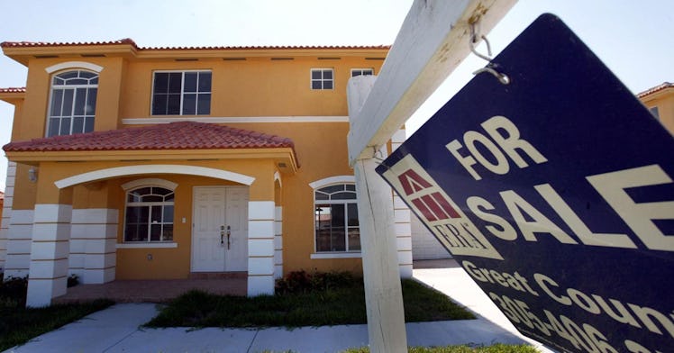 A house with a for sale sign on it