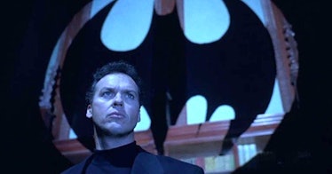 Michael Keaton in front of Bat Signal
