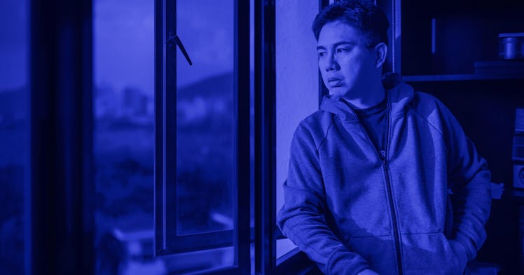 A man looking through the window