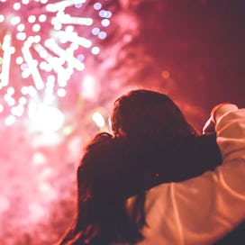 Two people watching fireworks together.