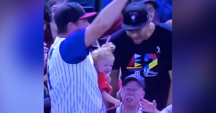 a dad caught a baseball at the Diamondbacks game