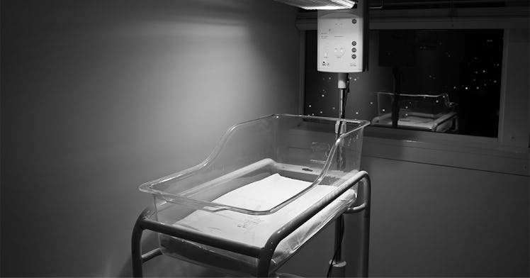 An empty baby bed in a hospital