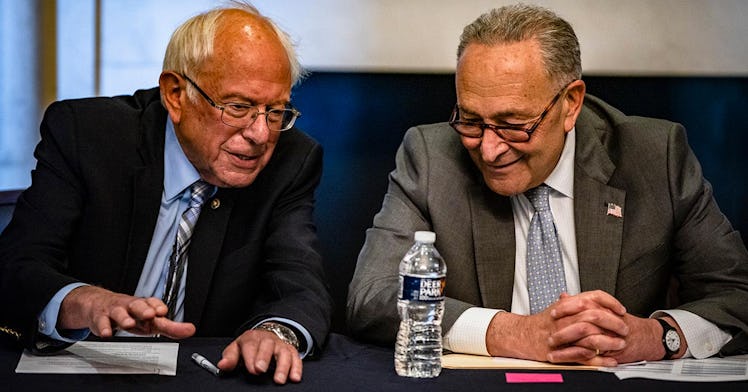 Senator Sanders and Chuck Schumer sit together and chat