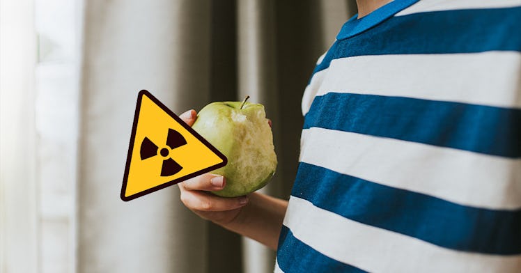 An apple with a toxic sign on it
