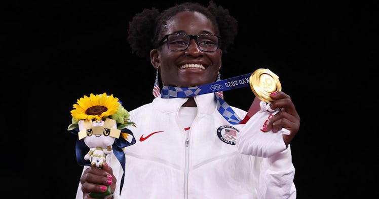 Tamyra Mensah-Stock stands with her gold medal