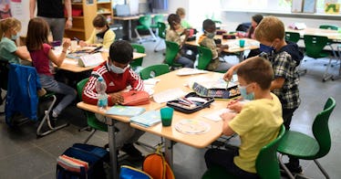 kids sit in a classroom