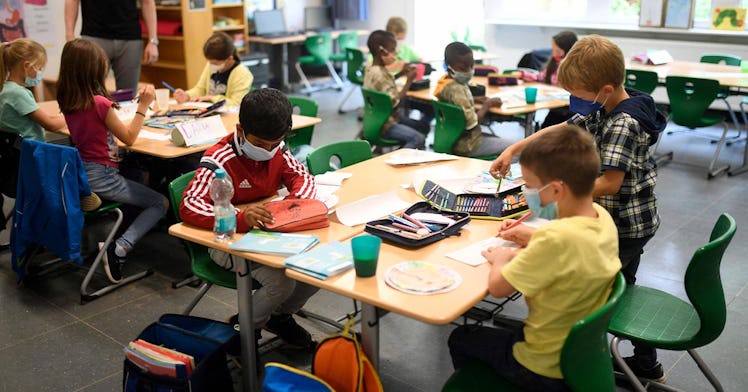 kids sit in a classroom