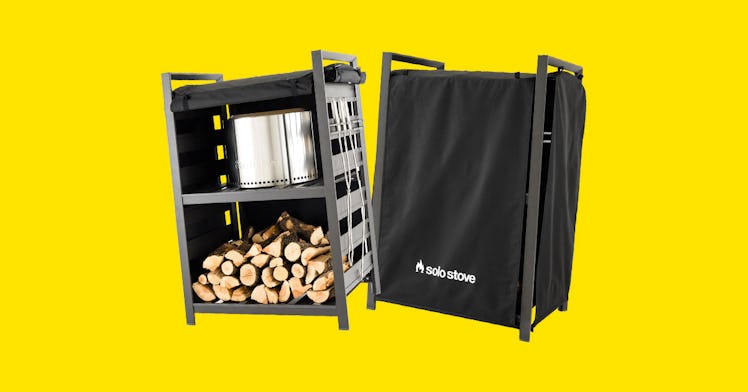 solo stove fire pit with wood storage is pictured against a yellow backdrop