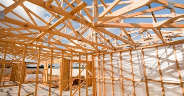 The wood beams of a house under construction