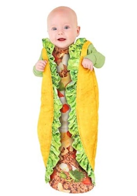 A baby wearing a Taco costume