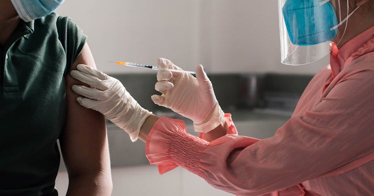 a person receives a COVID shot