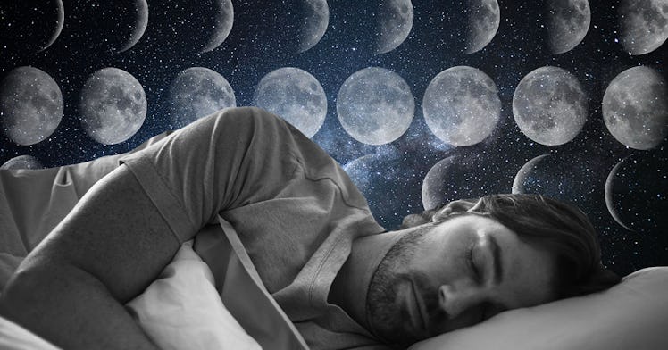A man sleeps in bed with multiple phases of the moon behind him