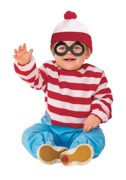 A little boy posing in a Where’s Waldo? costume