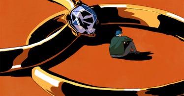 a man sits alone in the middle of two wedding bands indicating a lonely relationship