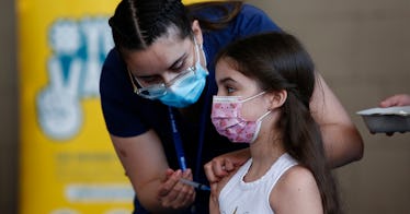 kid getting dosed with vaccine