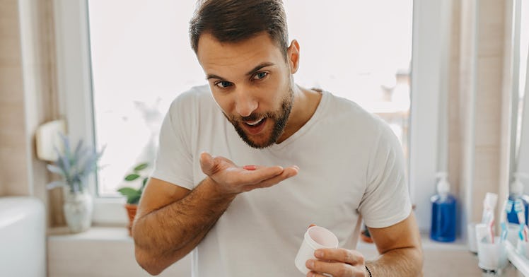 A man taking a vitamin D supplement.