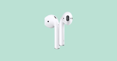 Apple AirPods on a pastel green background