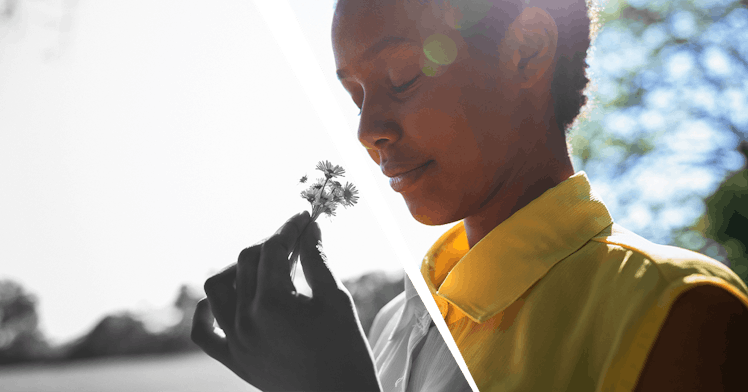 A child smelling a flower