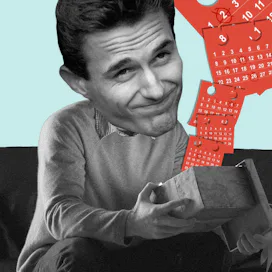 A man smiling and sitting on a couch, opening a box with monthly calenders flying out