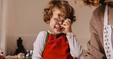 A small boy laughing at the Christmas Puns