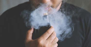 A man smokes an e-cig