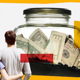 Couple looking at a jar of money.