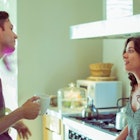 couple-arguing-in-kitchen-drinking coffee