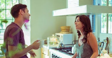 couple-arguing-in-kitchen-drinking coffee