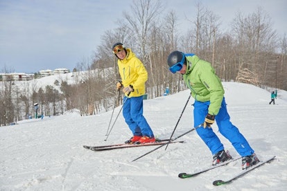 Two men skiing at Crystal Mountain, MI
