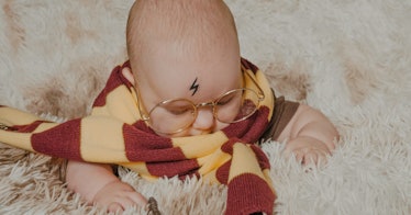 a baby dressed like Harry from Harry Potter