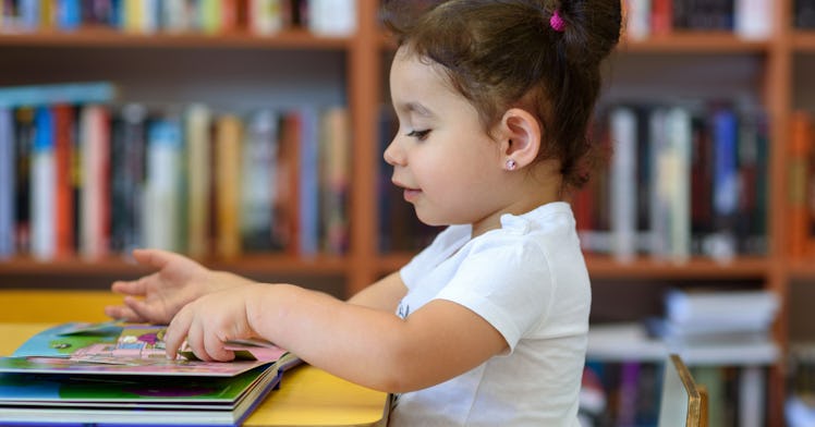 girl sitting at library desk