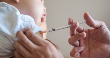 A baby receives the polio vaccine.