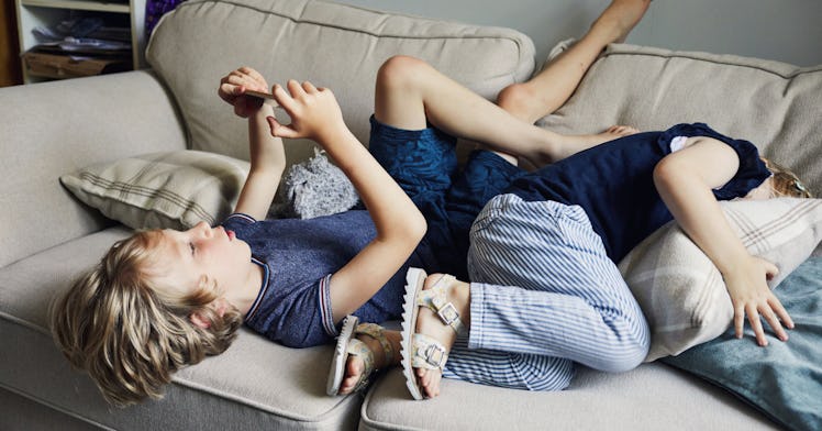 boy looking at phone screen time