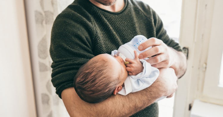 dad giving baby a bottle